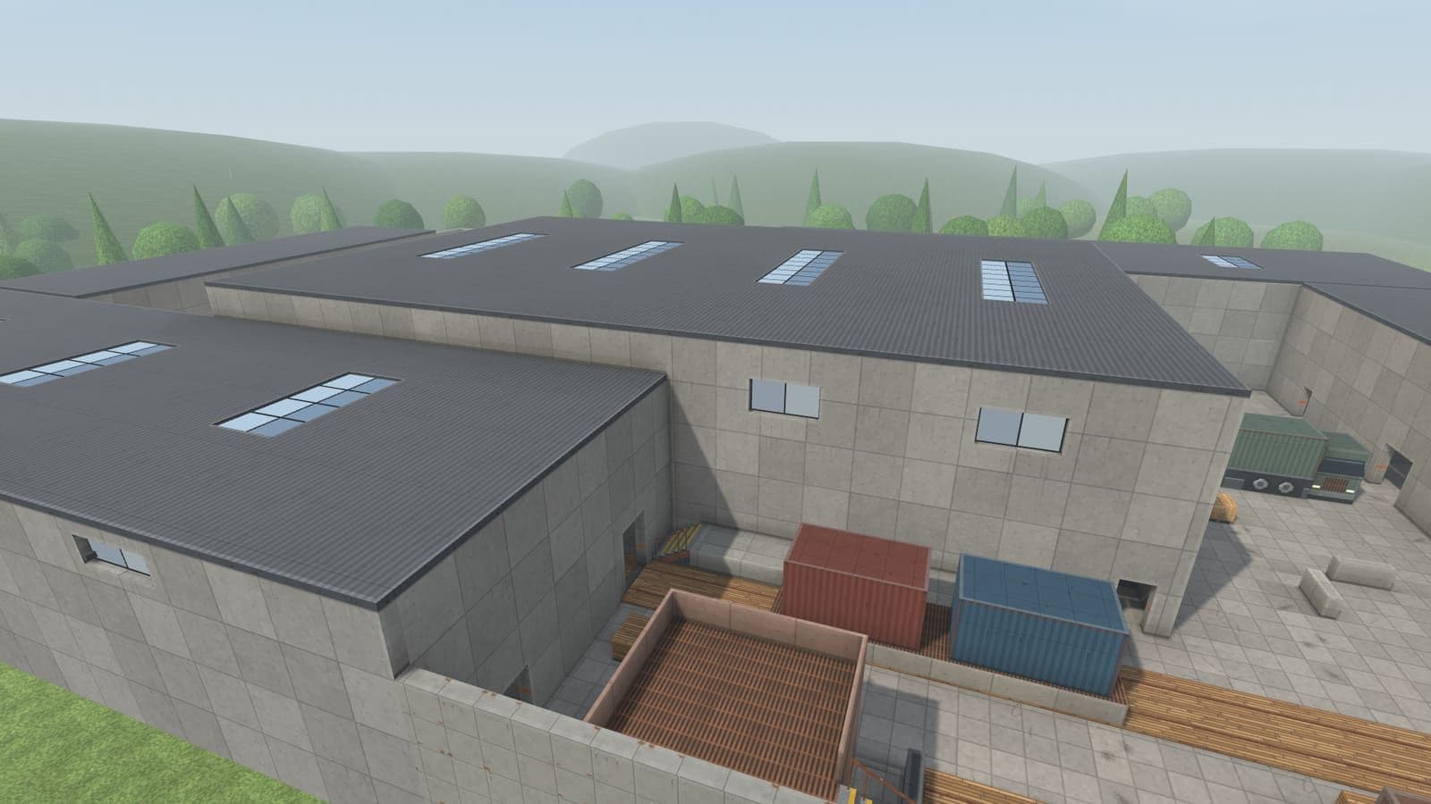 The Zavod plant from above: sawtooth roofs with skylights, a walled yard with containers and a truck at the gate.